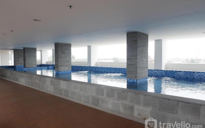 Homey & Cozy Living Studio at Poris 88 By Travelio