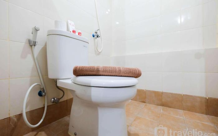 Comfy 2BR Bassura City Apt near Mall By Travelio