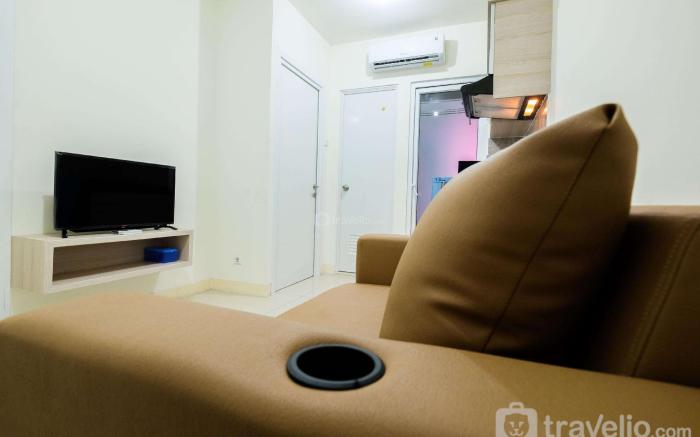 Cozy 2BR Green Pramuka Apartment By Travelio