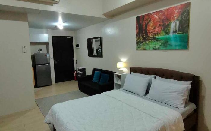 ROOMY Condotel Across NAIA T3