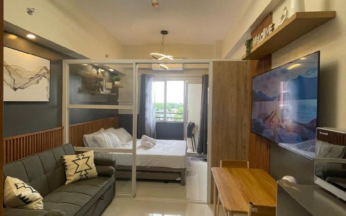 Bright & Stylish Condo w/ Pool View + Balcony