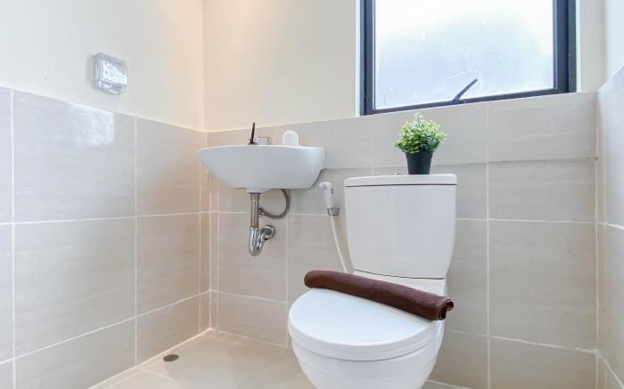 Warm 1BR with Makeup Room at Meikarta By Travelio