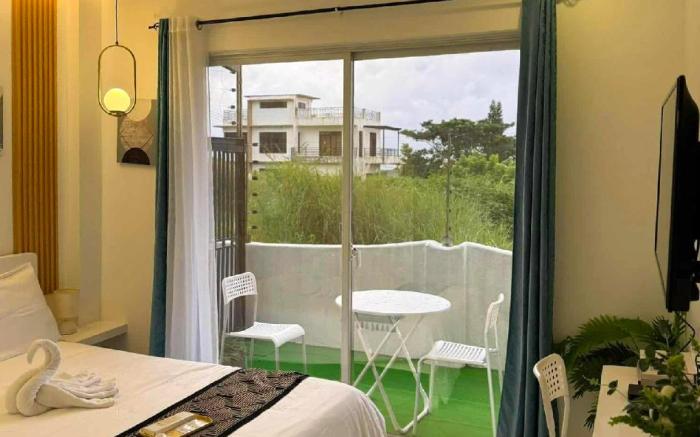 Deluxe Room 102 w/ Private Balcony