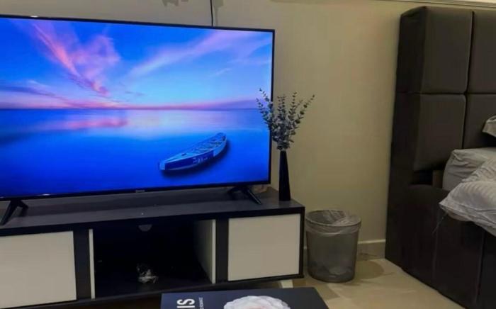 Self check-in studio with a comfortable bed