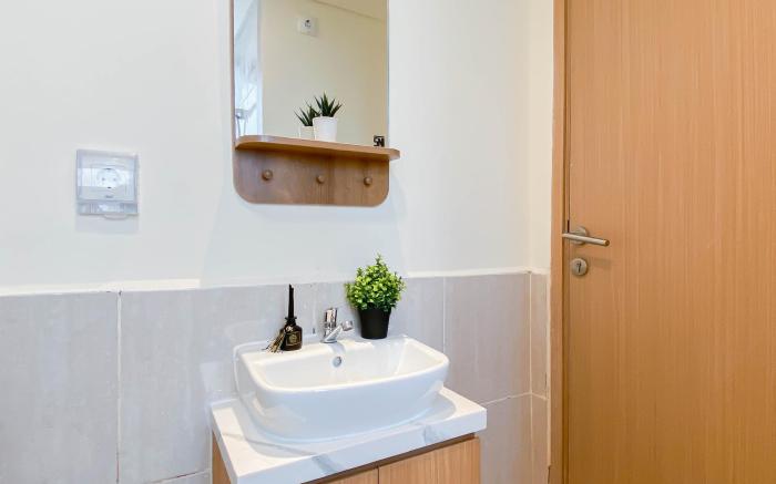 Modern 2BR at Meikarta Apt near AEON By Travelio