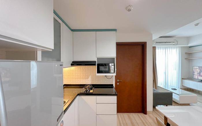 Near Mall 3BR at Grand Sungkono Lagoon By Travelio