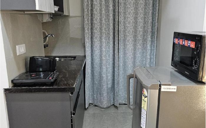 Modern Studio with Kitchenette & Cozy Seating