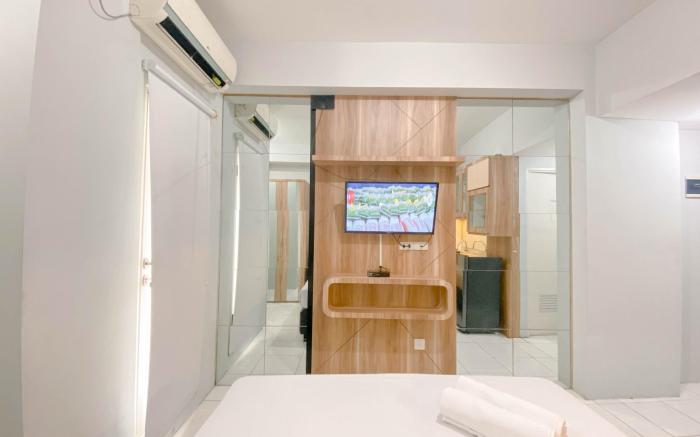 Basic Studio at Candiland Apartment By Travelio
