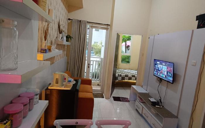 Malioboro City Apartment Family Room by Liliput