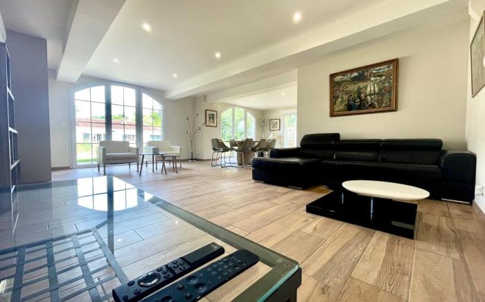 Large house in the forest bordering a lake