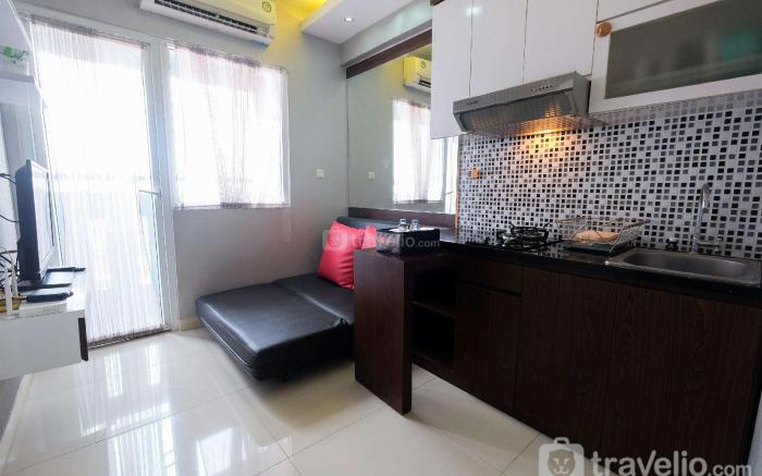 Homey 2BR Green Pramuka Apartment By Travelio