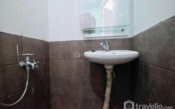Homey 2BR Green Pramuka Apartment By Travelio
