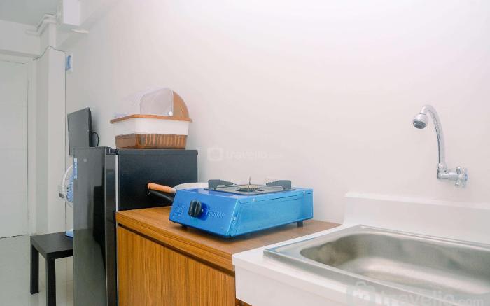 Fully Furnished 1BR Bassura City Apt By Travelio