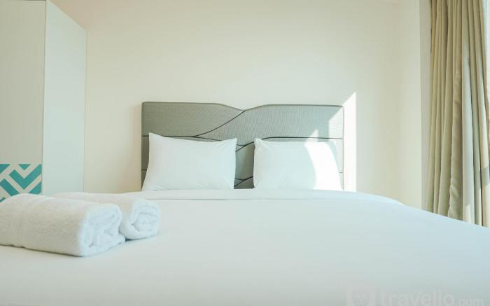 Cozy Living 1BR at Tifolia Apartment By Travelio