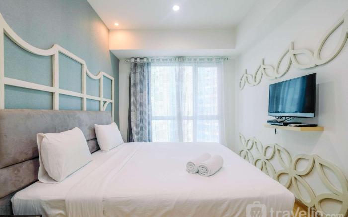 Minimalist 1BR Apartment @ Casa Grande By Travelio