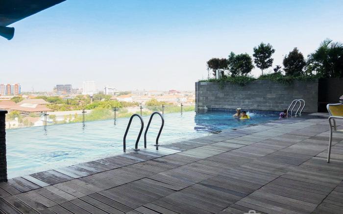 Warm Studio Apt at Tamansari Papilio By Travelio