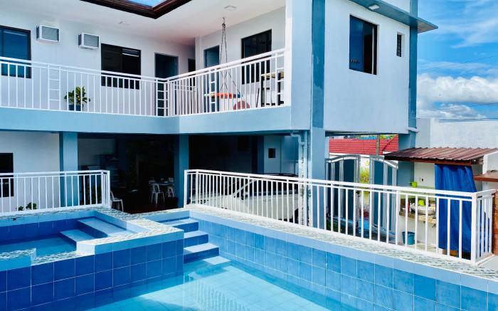 Refreshing 4 bedroom home with a waterfall pools