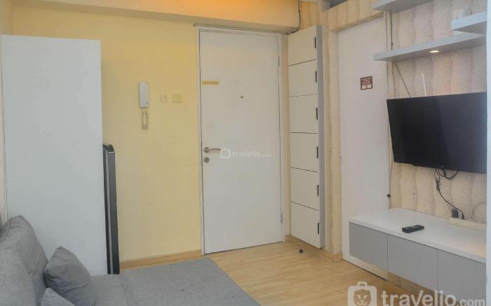 Minimalist & Warm 2BR at Bassura City By Travelio