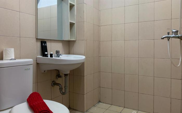 Warm and Cozy 2BR at Tifolia Apartment By Travelio