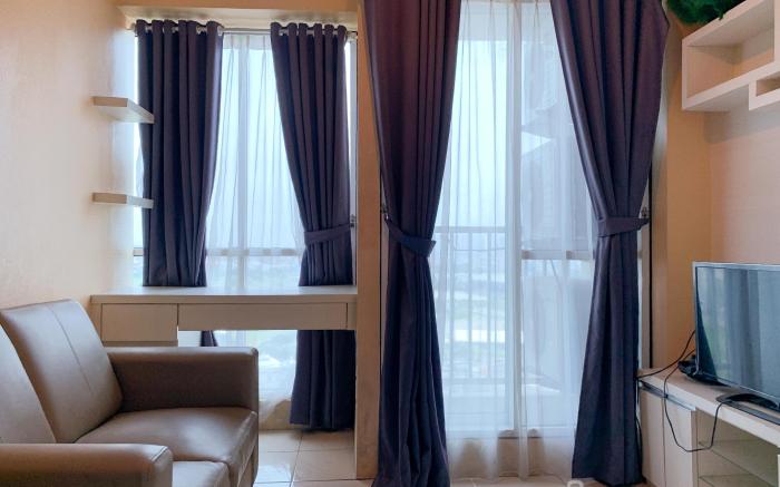 Warm and Cozy 2BR at Tifolia Apartment By Travelio