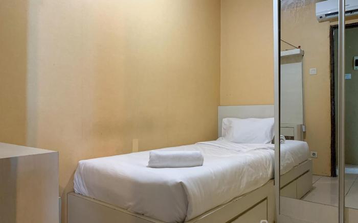 Warm and Cozy 2BR at Tifolia Apartment By Travelio