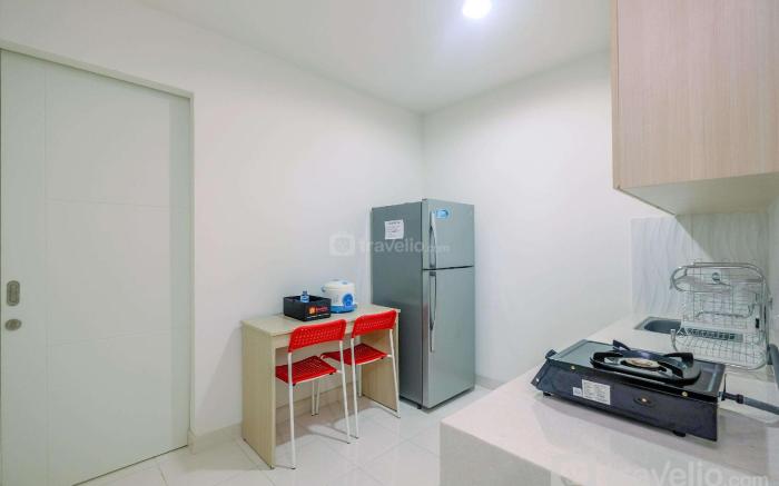Homey 2BR at Sentul Tower Apartment By Travelio