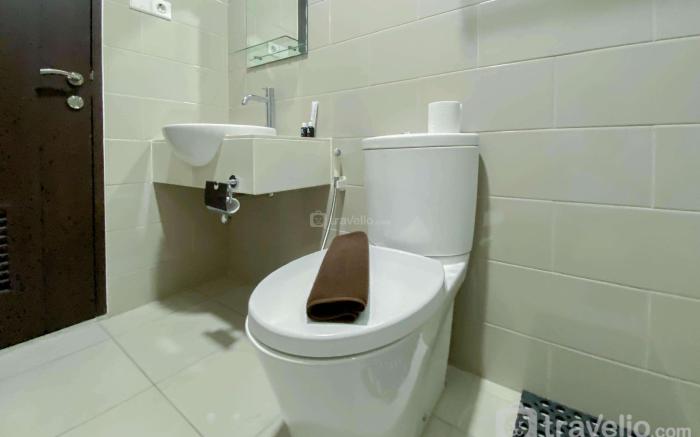 Best Deal 1BR at Citralake Suites Apt By Travelio