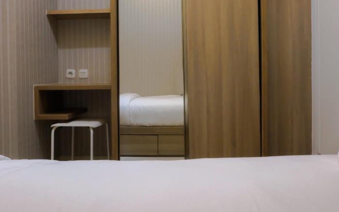 Cozy 2BR Green Pramuka Apartment By Travelio