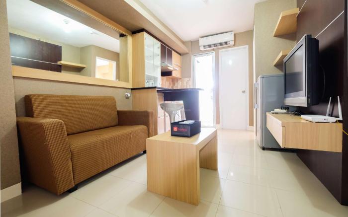 Homely 2 BR Bassura City Apartment By Travelio