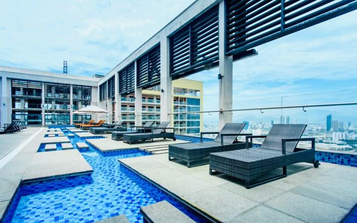 Hosted by LIVIE, Beachfront Comfort Suite