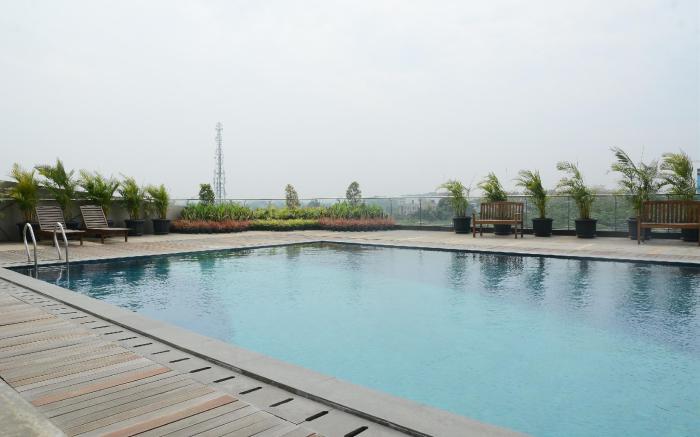 Homey 1BR Tree Park City BSD Apartment By Travelio
