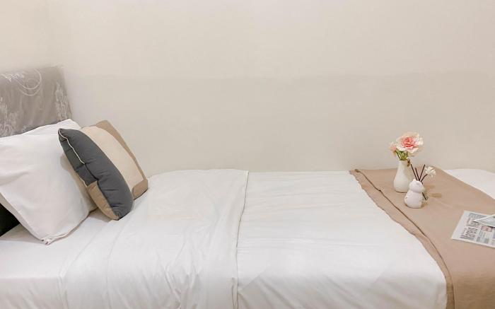 Living 2BR Green Pramuka City Apt By Travelio