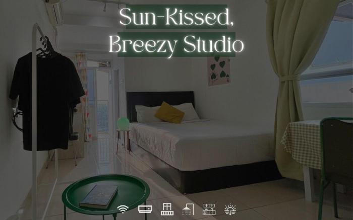 Sun-Kissed, Breezy Studio with a Green Glow