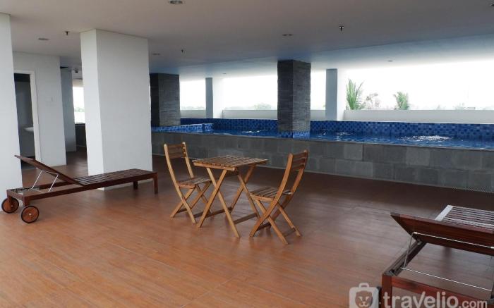 Homey & Cozy Living Studio at Poris 88 By Travelio