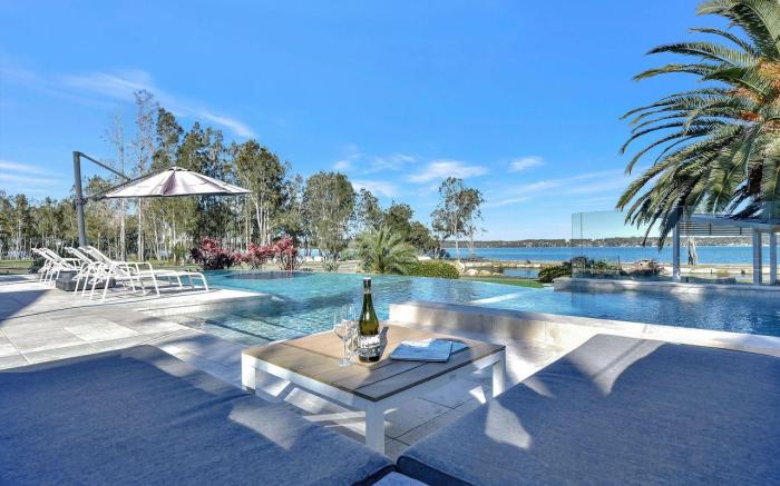 Lake Palm Resort Luxury Retreat absolute Waterfront on 3 acres at Lake Macquarie.