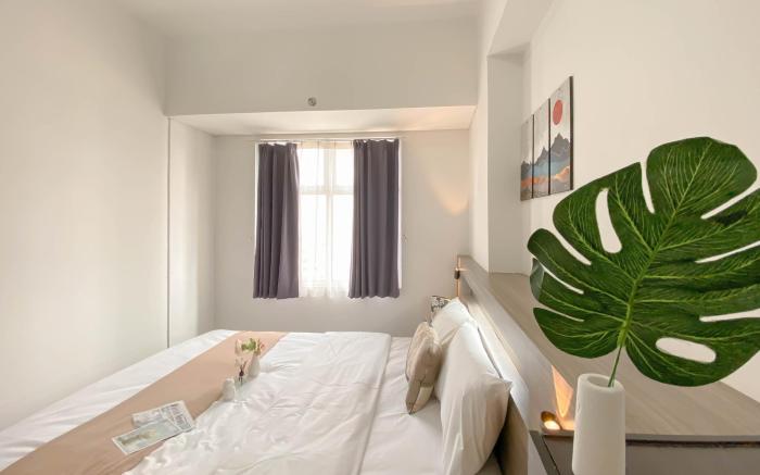 Minimalist 1BR Apt Vittoria Residence By Travelio