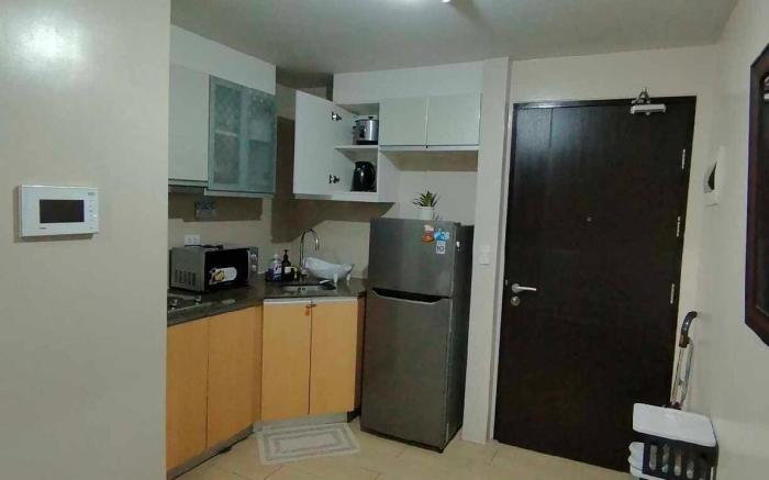 ROOMY Condotel Across NAIA T3
