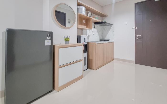 Minimalist 1BR Patraland Amarta Apt By Travelio