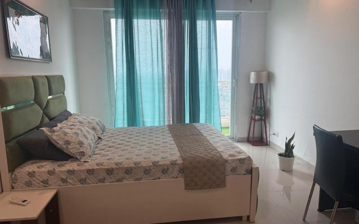 SkySwimStay – Luxury High-Rise Apartment with Pool