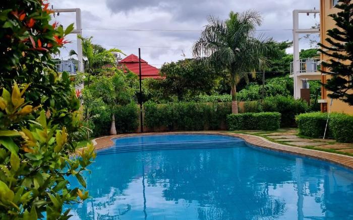 Verdant Condo w/ Pool, Balcony, Near Airport 