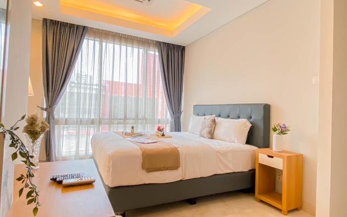 2BR Apt at Masterpiece The Epicentrum By Travelio