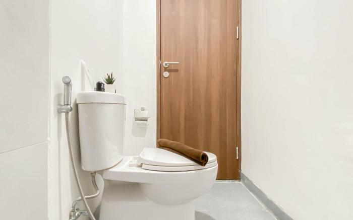 Soft Grey 1BR at Royal Sentul Park By Travelio