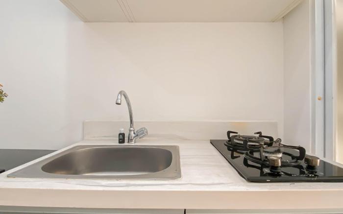 1BR at Vittoria near Puri Indah Mall By Travelio