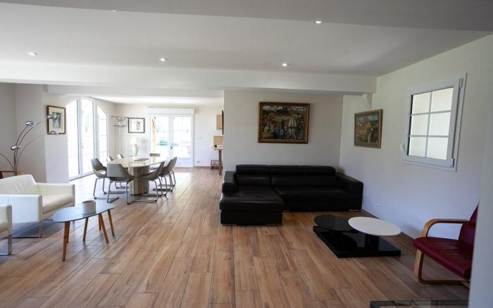 Large house in the forest bordering a lake