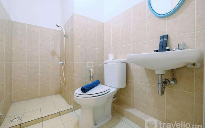 Homey 2BR at Green Bay Pluit Apartment By Travelio