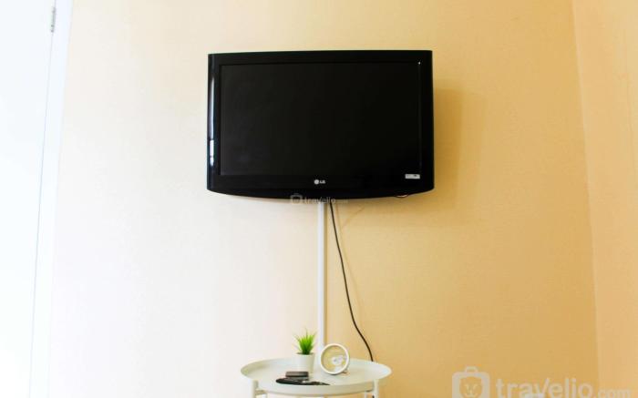 City View 1BR @Green Pramuka Apartment By Travelio