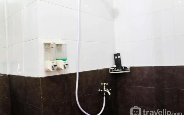 City View 1BR @Green Pramuka Apartment By Travelio