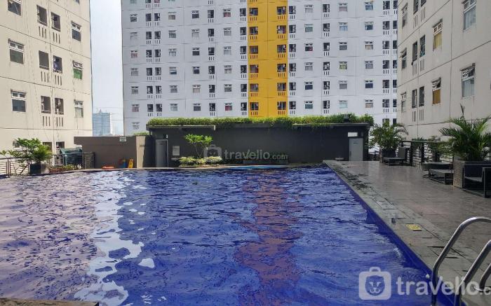 City View 1BR @Green Pramuka Apartment By Travelio