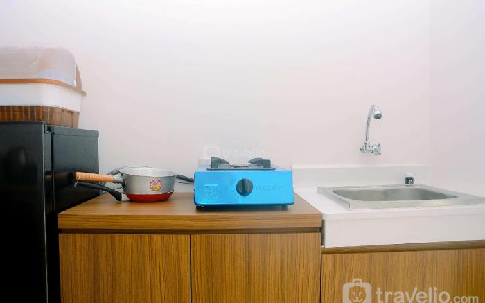 Fully Furnished 1BR Bassura City Apt By Travelio