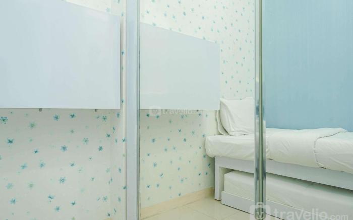 Best Comfy 2BR Green Pramuka Apartment By Travelio